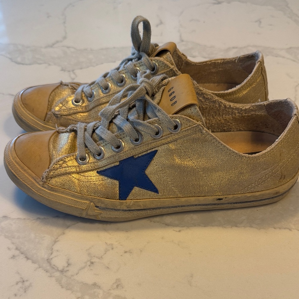 Golden Goose Gold Sneakers with Blue Star